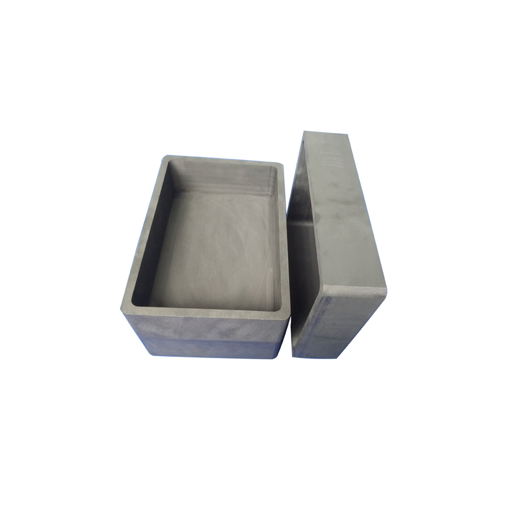 Caja de grafito rectangular de alta pureza con tapa, utilizada para la sinterizaci&oacute;n de materiales en polvo a alta temperatura, con superficie lisa y bordes precisos